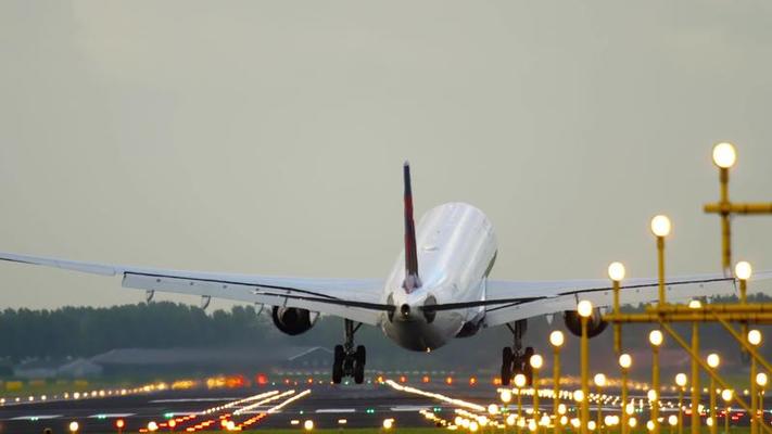 A plane taking off from a rainy runway with clear skies ahead, symbolizing the journey from Seattle to Arizona for recovery